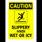 Sign caution slippery when wet or icy